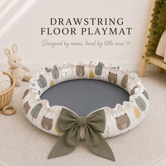 Drawstring floor playmat with bear pattern on a light wooden floor.