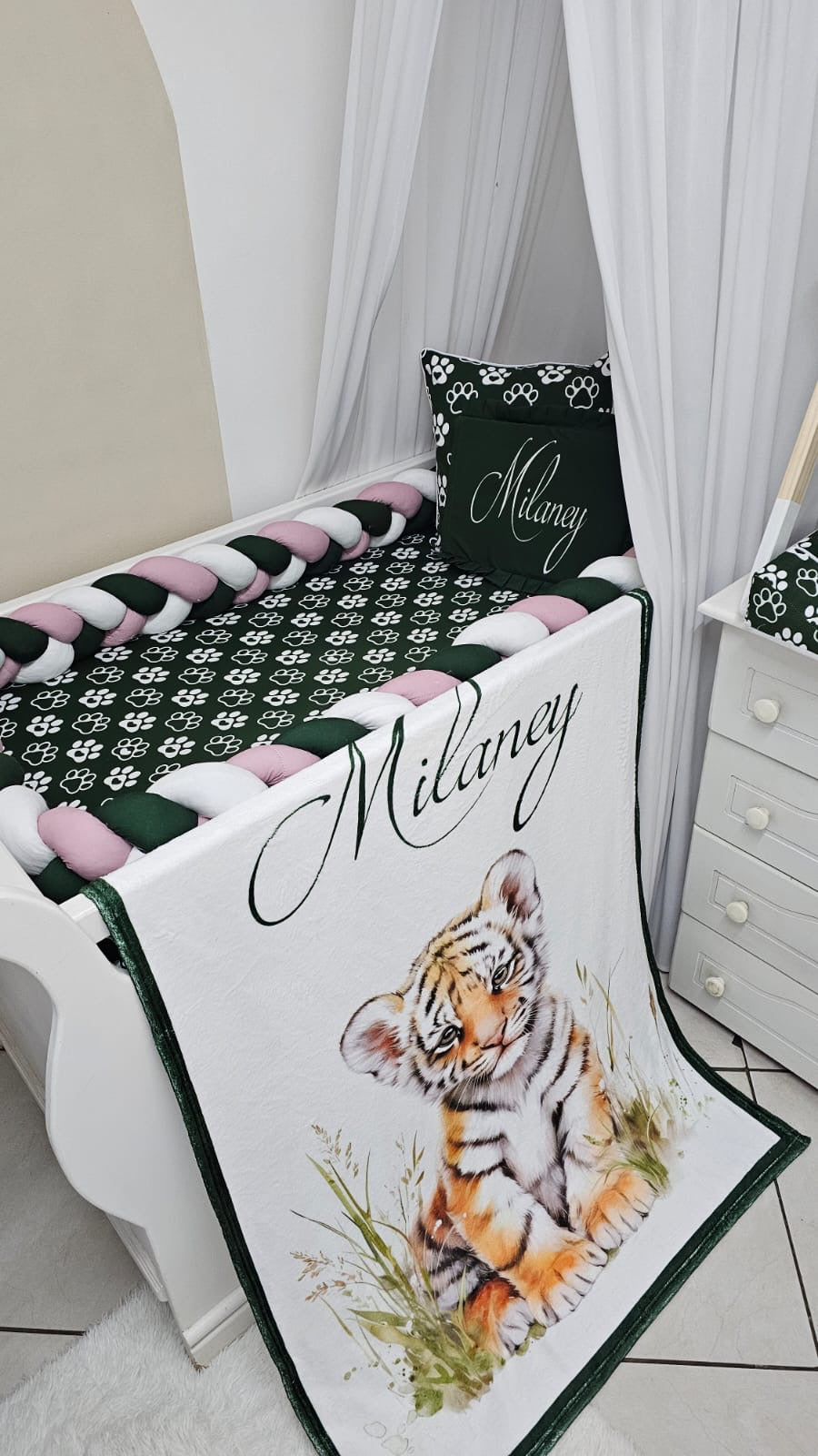 Personalised baby blanket with watercolor tiger illustration hanging over cot