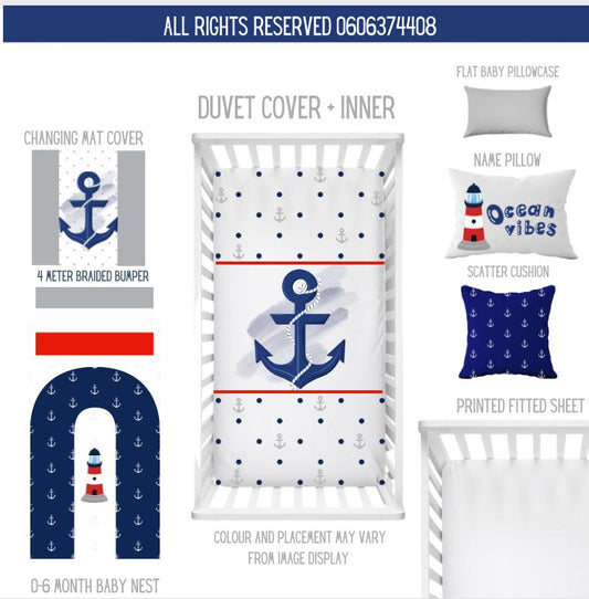 Anchors Away nautical cot bedding set featuring navy anchors, lighthouse details, blue polka dots and red accents with matching baby nest, cushions and cot accessories | Anchors Away nautiese bababeddegoedstel met donkerblou ankers, vuurtoring-detail, blou kolletjies en rooi aksente met ’n bypassende babanes, kussings en bababed-bykomstighede.