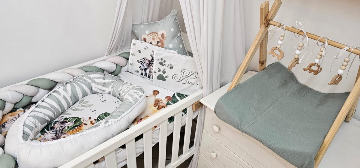 Children's room with crib, canopy, and decorative elements.