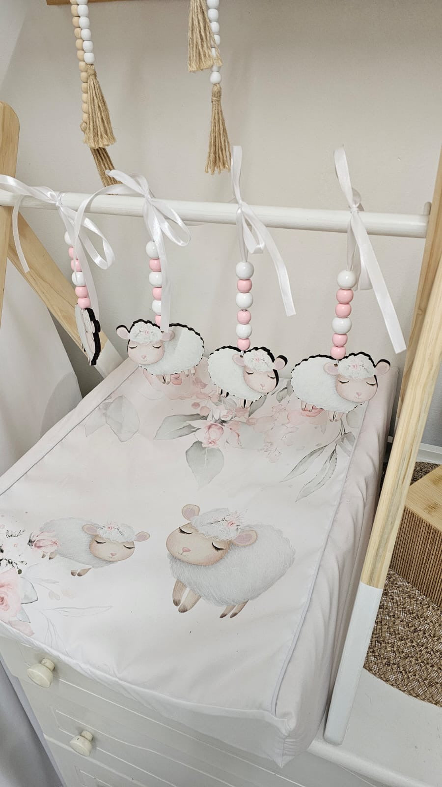 Baby crib with sheep design and hanging mobile