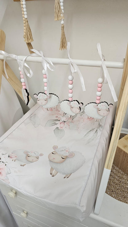 Baby crib with sheep design and hanging mobile