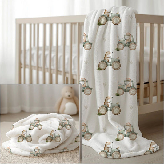 Dino Tractor Tails fleece blanket featuring sweet little dinosaurs riding vintage-style tractors in soft sage, beige and neutral tones on a white background | Dino Tractor Tails fleece-kombers met oulike klein dinosourusse wat op klassieke trekkers ry in sagte saliegroen, beige en neutrale kleure op ’n wit agtergrond.