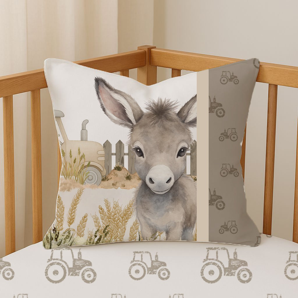 Donkey Dreams scatter cushion featuring a sweet grey donkey, tractor and wheat field design with a coordinating neutral tractor print | Donkey Dreams sierkussing met ’n oulike grys donkie, trekker en koringland-ontwerp met ’n bypassende neutrale trekkerpatroon.