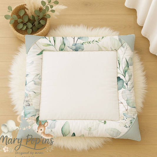 Eucalyptus baby playmat featuring a soft sage and green leafy botanical border with a clean cream centre in a calm neutral nursery style | Eucalyptus baba-speelmat met ’n sagte salie- en groen botaniese blaarrand en ’n skoon roomkleurige middel in ’n rustige neutrale kinderkamer-styl.