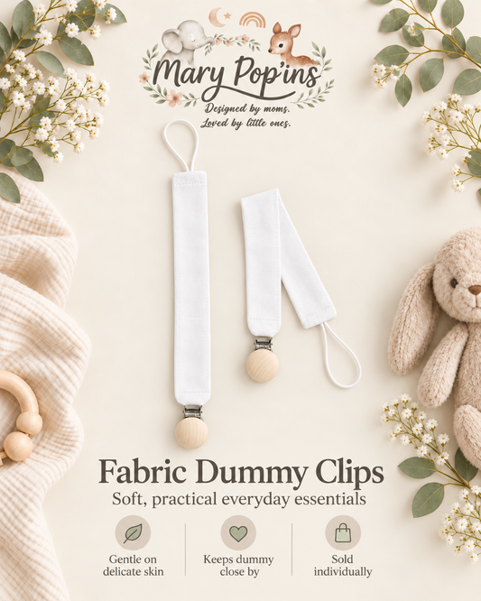 Two white fabric dummy clips with wooden ball tips and metal clasps, displayed on a soft cream background with decorative flowers, a plush bunny, and text reading Mary Poppins and Fabric Dummy Clips.