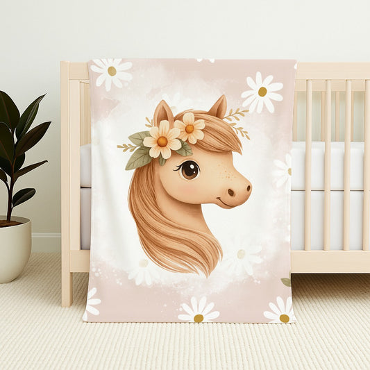 Horsey Blossom fleece blanket featuring a sweet horse with a floral crown, soft daisies and blush pink neutral tones for a gentle nursery design | Horsey Blossom fleece-kombers met ’n oulike perdjie met ’n blomkroon, sagte madeliefies en ligpienk neutrale kleure vir ’n sagte kinderkamer-ontwerp.