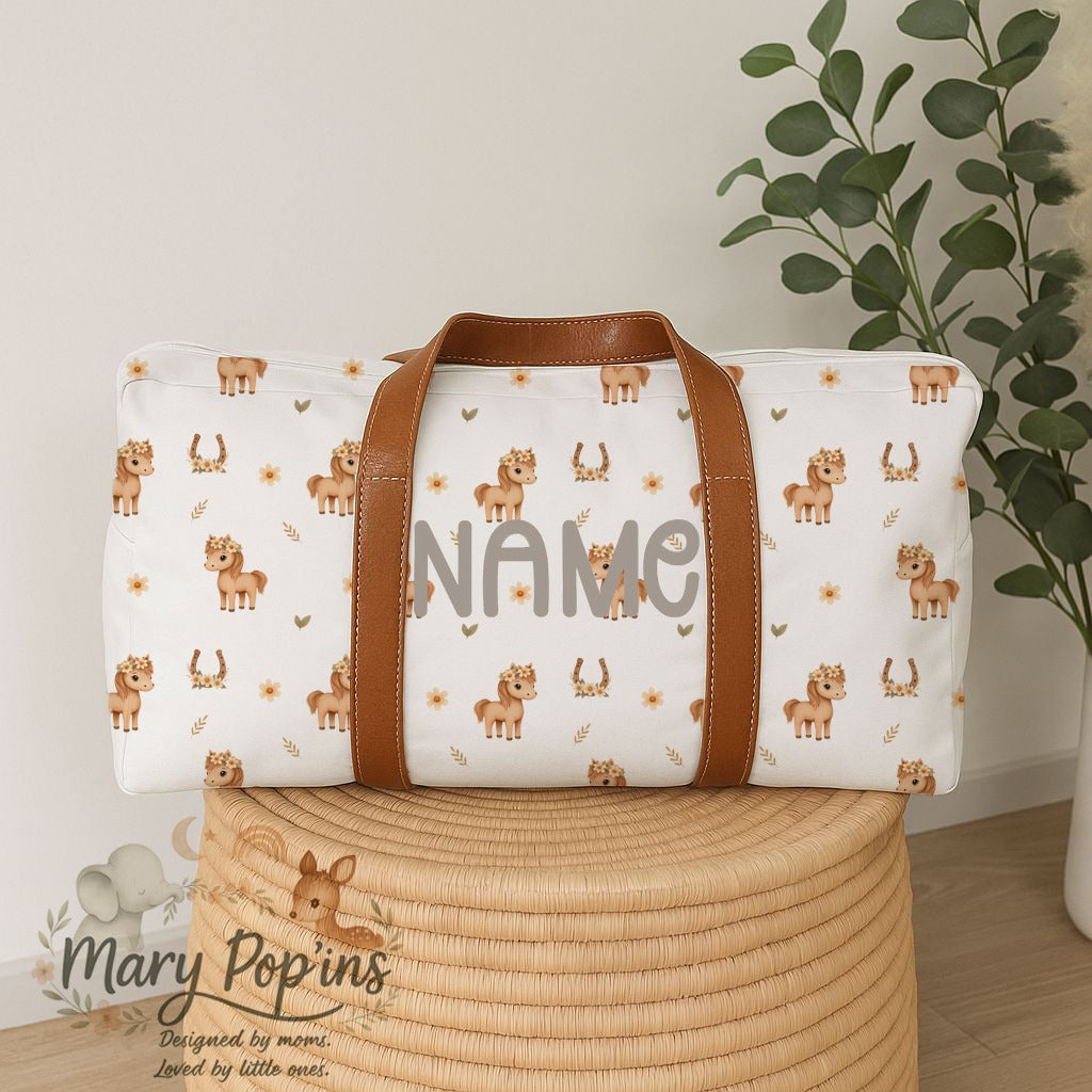 Personalised Horsey Blossom hospital bag featuring sweet little horses, floral crowns, horseshoes and delicate peach floral details with brown handles | Gepersonaliseerde Horsey Blossom hospitaaltas met oulike perdjies, blomkrone, hoefysters en sagte perskekleurige blomdetail met bruin handvatsels.