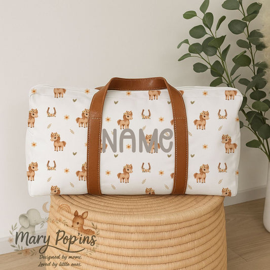 Personalised Horsey Blossom hospital bag featuring sweet little horses, floral crowns, horseshoes and delicate peach floral details with brown handles | Gepersonaliseerde Horsey Blossom hospitaaltas met oulike perdjies, blomkrone, hoefysters en sagte perskekleurige blomdetail met bruin handvatsels.