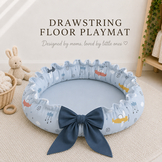 Drawstring floor playmat with cartoon plane pattern and blue bow, placed on a carpeted floor.Playmat. Nest ,Baby Nursery, baby shower gift, Mary Popins, Baby Linen Airoplane, 