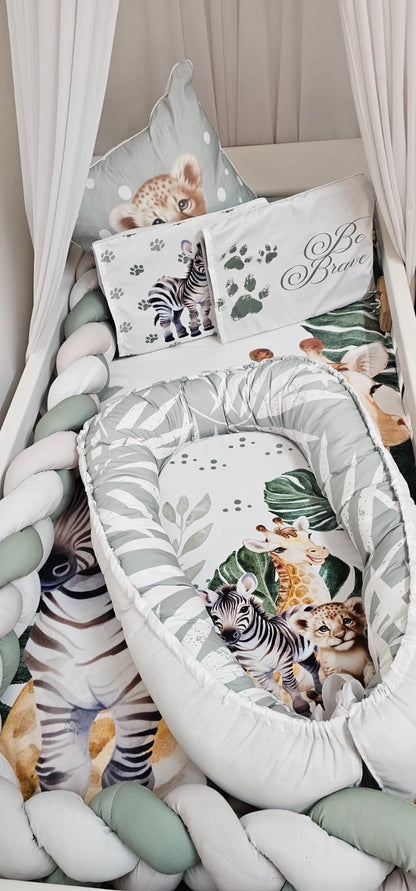Children's room with a canopy bed, pillows, and stuffed animals.
