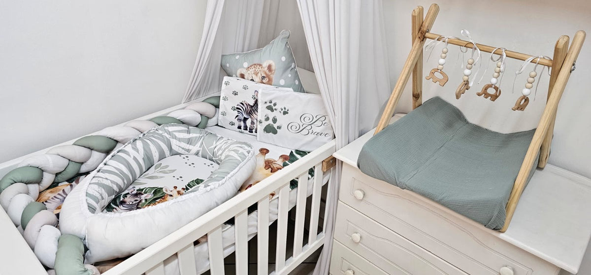 Nursery room with crib, canopy, and wooden play gym.